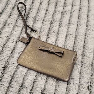 Cute metallic Coach bow wristlet